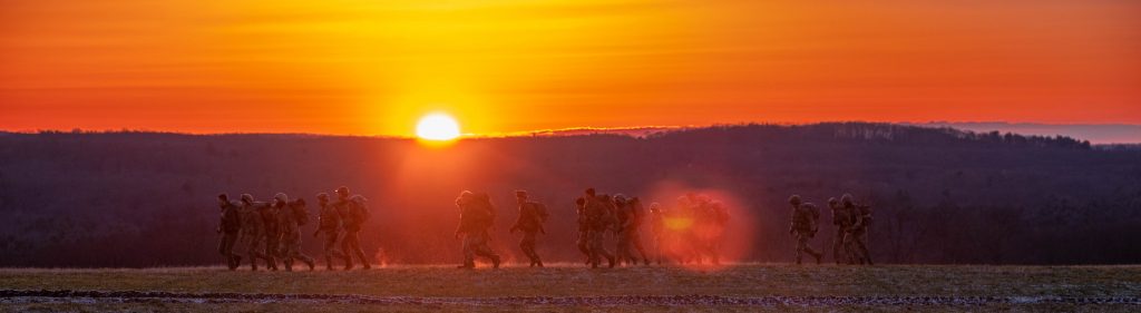 ROTC cadets rucking on Horsebarn Hill at sunrise.